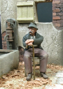 F.085  GRANDPA SEATED ON A CHAIR